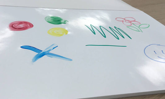 Colorful drawings on a white sheet of paper