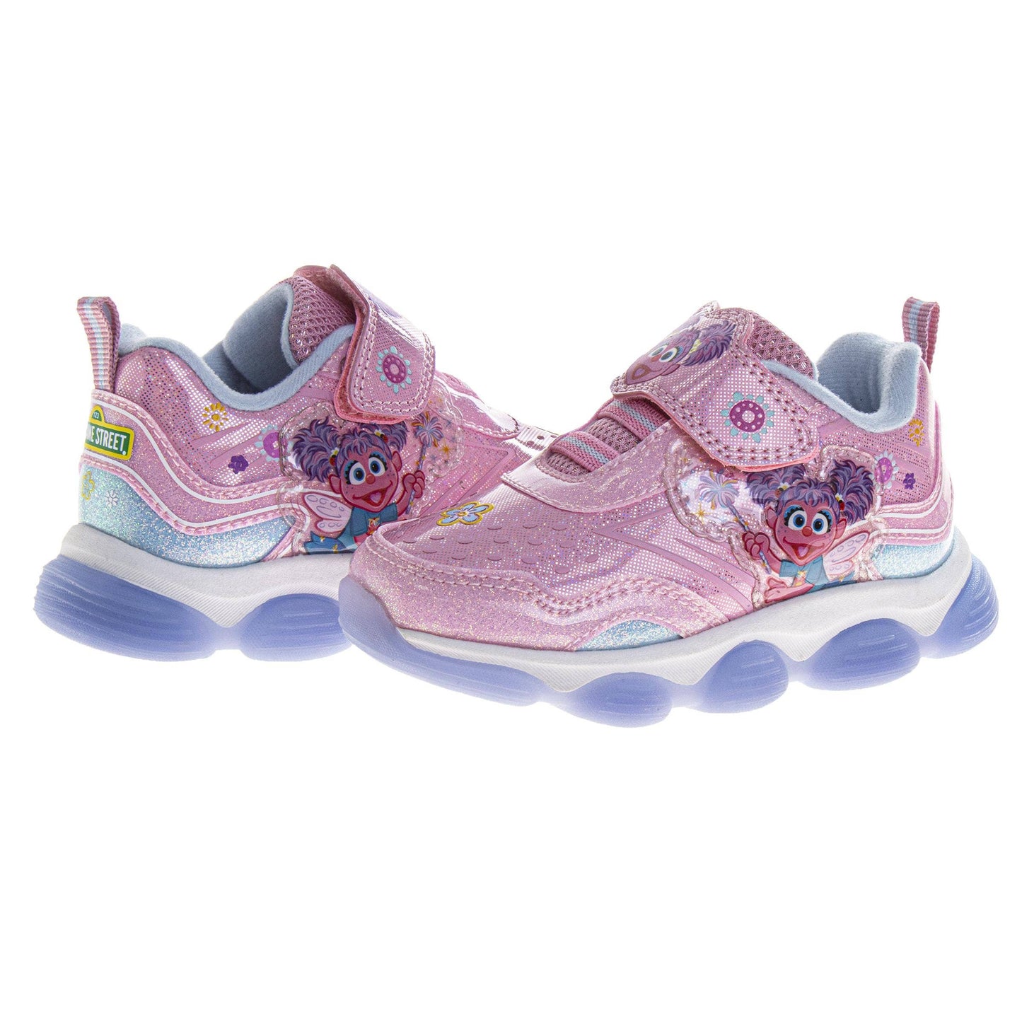 Pink children's sneakers with character design on a white background