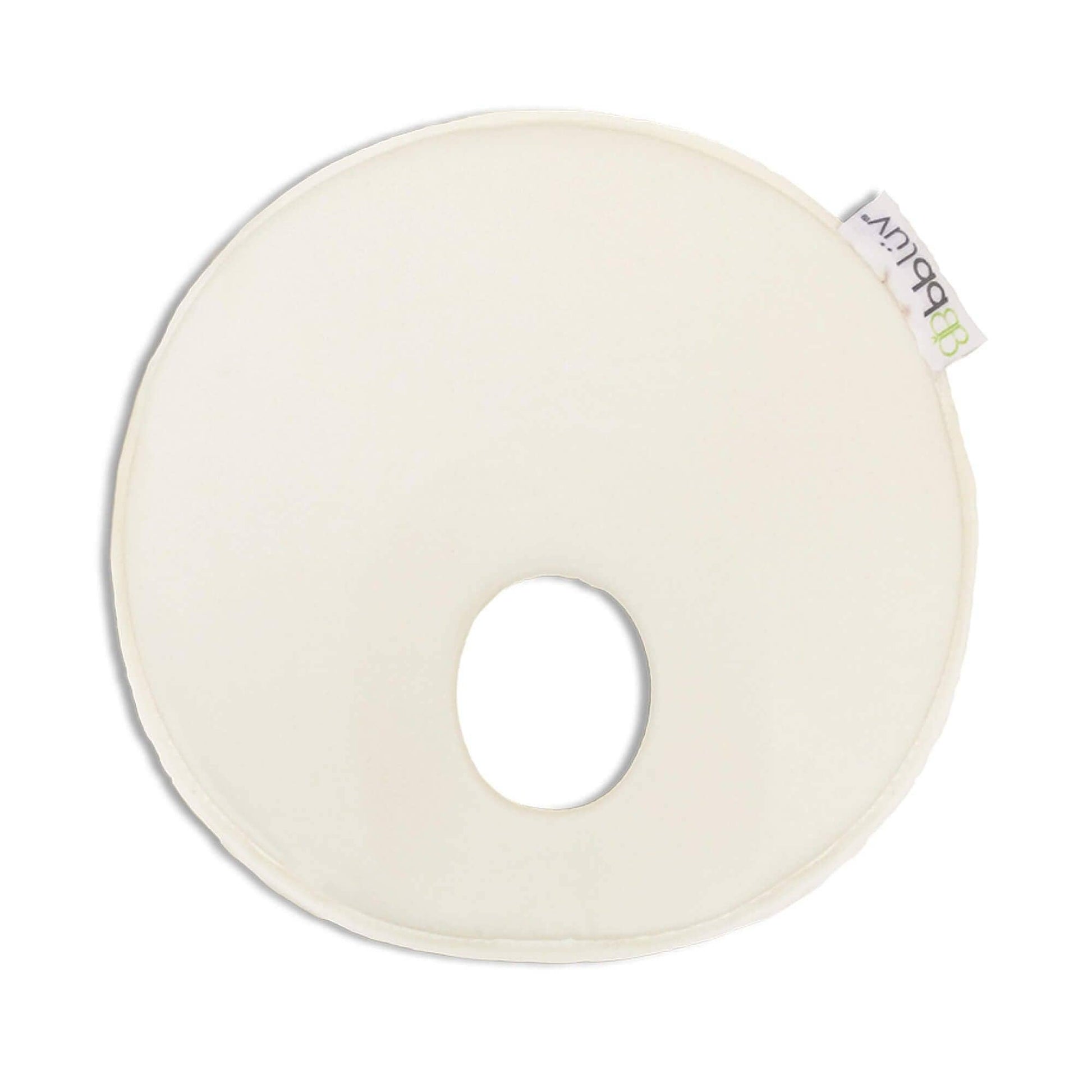 Round white cushion with a small hole in the center on a white background