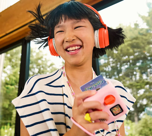 A girl wearing an orange headphone