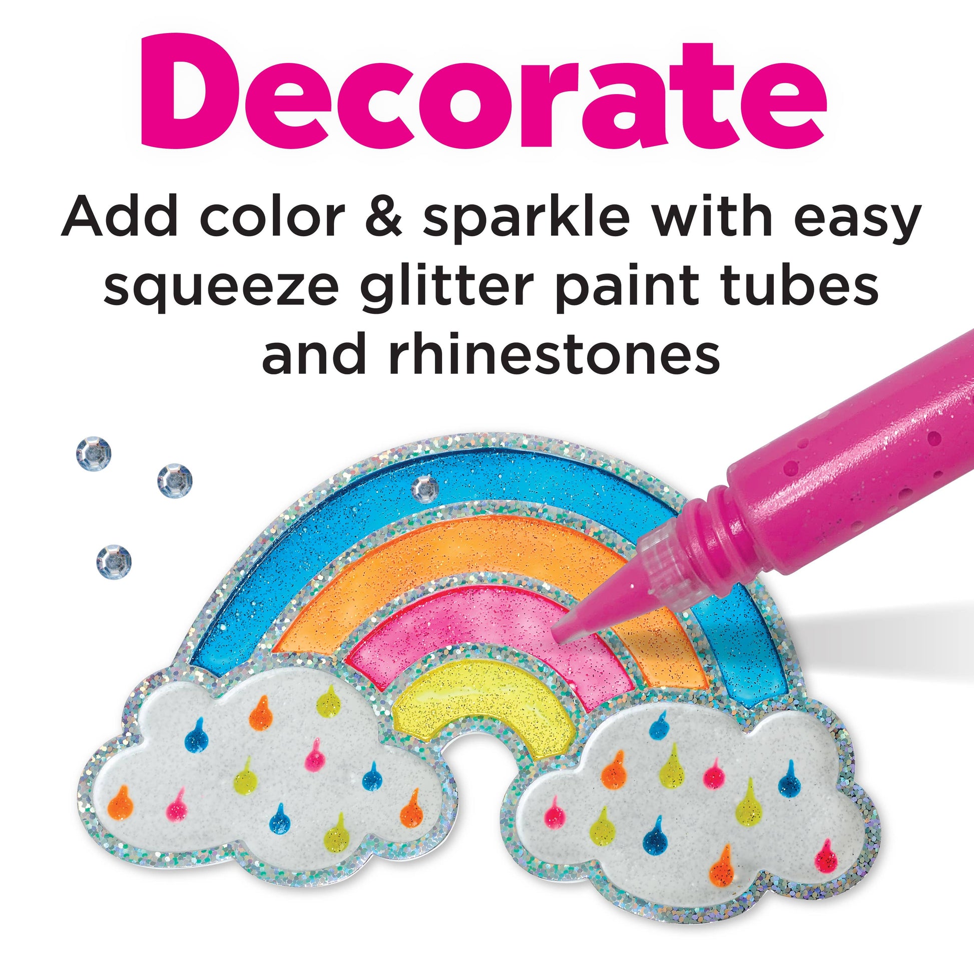 Decorative craft project with a rainbow and cloud design, using glitter paint and rhinestones.