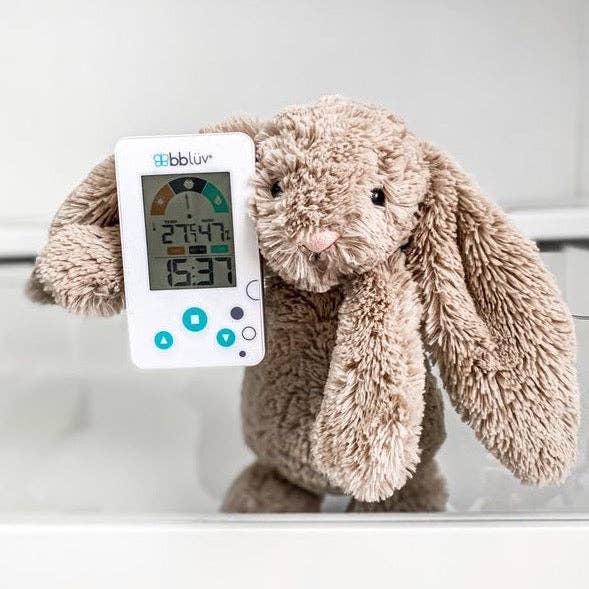 Plush bunny holding a digital thermometer with 'gibbbluv' branding on a white background