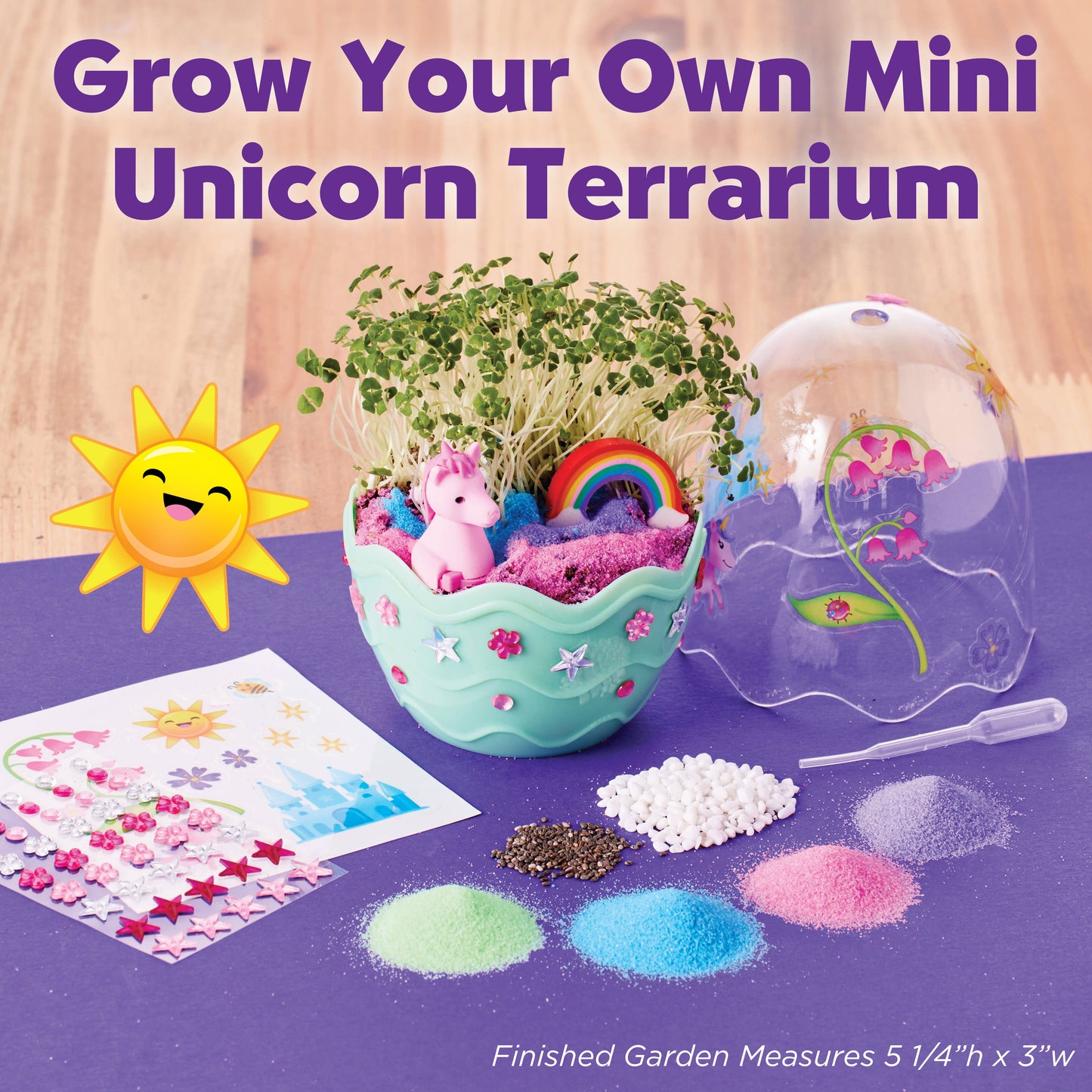 Unicorn terrarium kit with materials and tools on a purple surface, featuring text 'Grow Your Own Mini Unicorn Terrarium'.