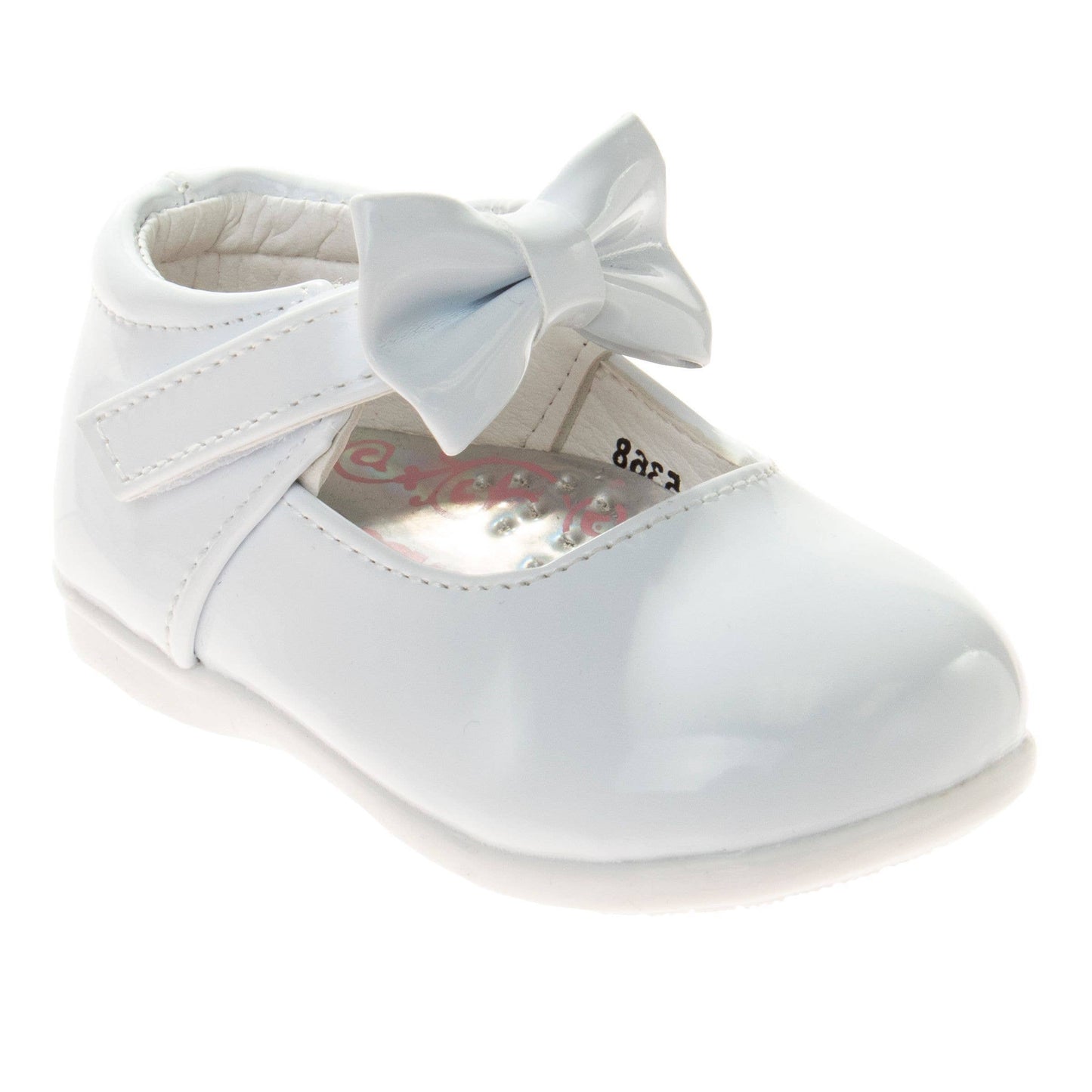 White baby shoe with a bow on a white background