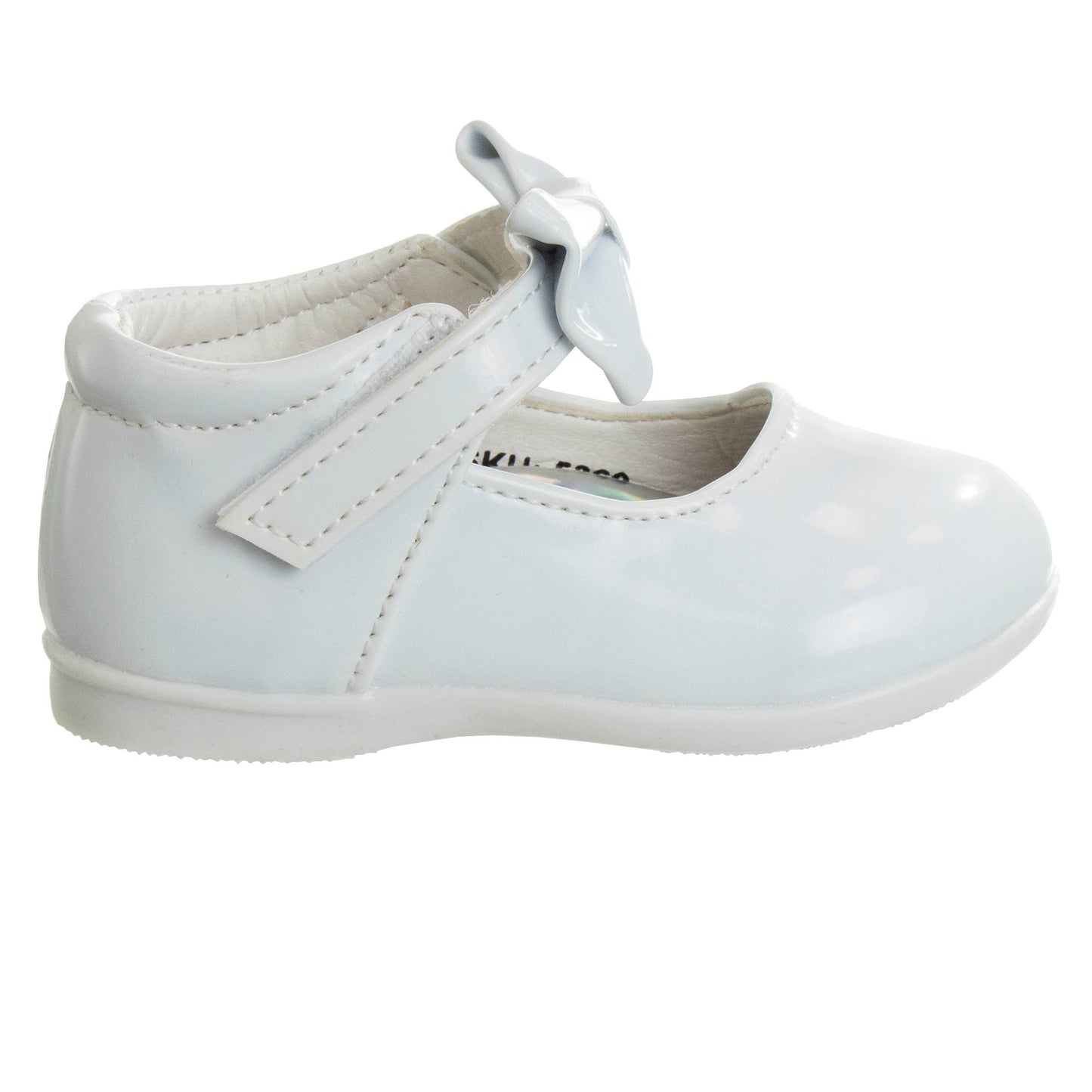 White child's shoe with a bow on a white background 3