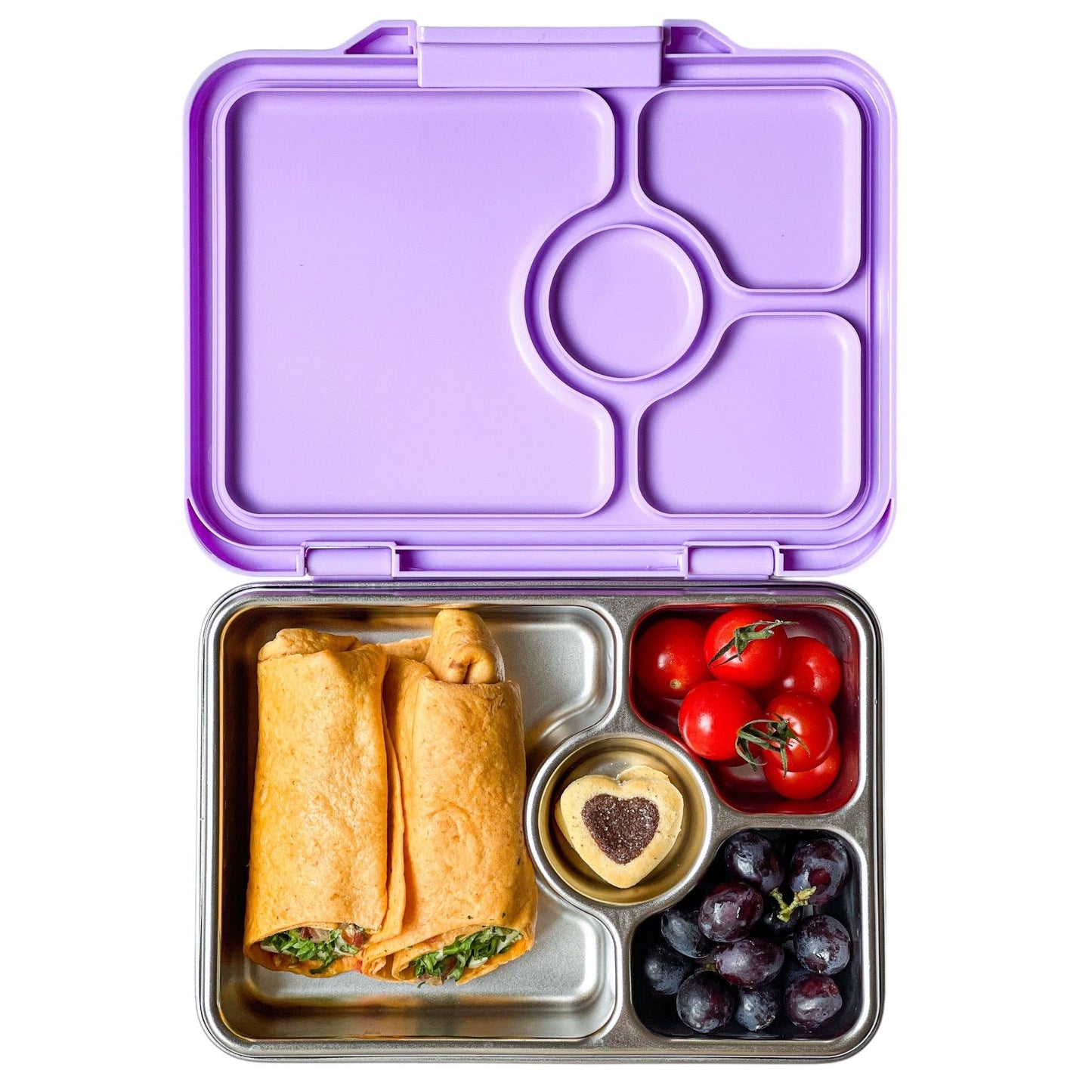 Yumbox lunch box with stainless steel body and purple lid, full of food, on white background