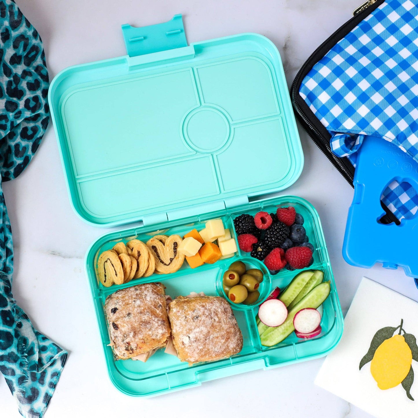 light blue lunch box with food 1